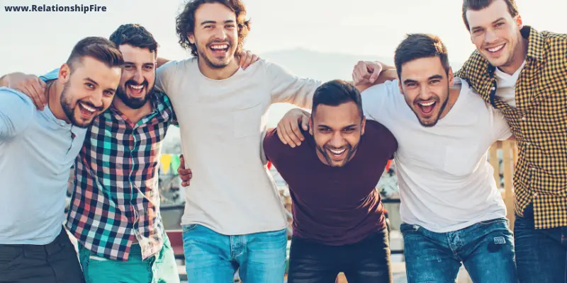 Group of men smiling—Is Dating Harder for Men