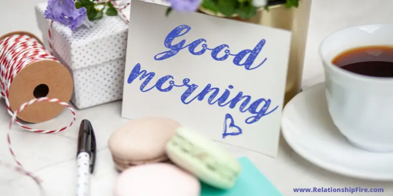 Table with coffee and a card that says good morning—Do Guys Like Good Morning Texts