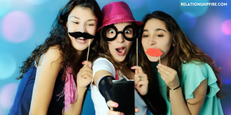 Three girls in funny outfits taking a picture—Do Guys Like Funny Girls