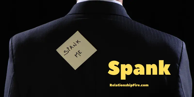 Suited man with a stick-it-note that says "spank me"—Reasons Guys Like to Spank